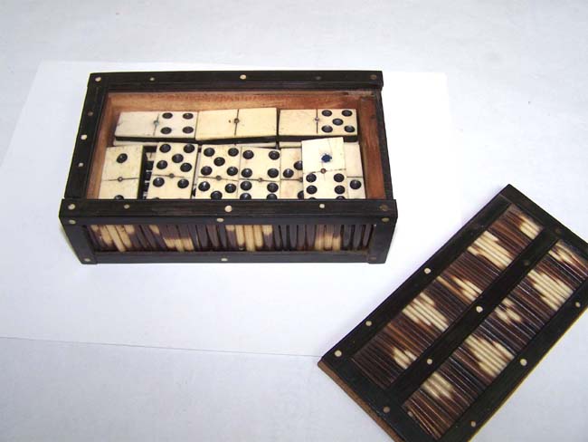 A set of 19th century Bone and Ebony Dominoes in a Porcupine Quill and Ebony Box circa 1875